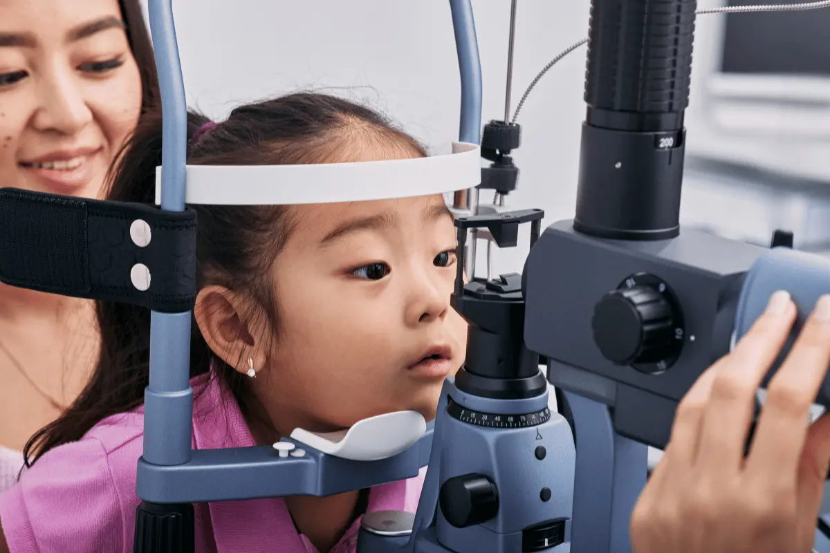 a little girl getting a back-to-school eye exam
